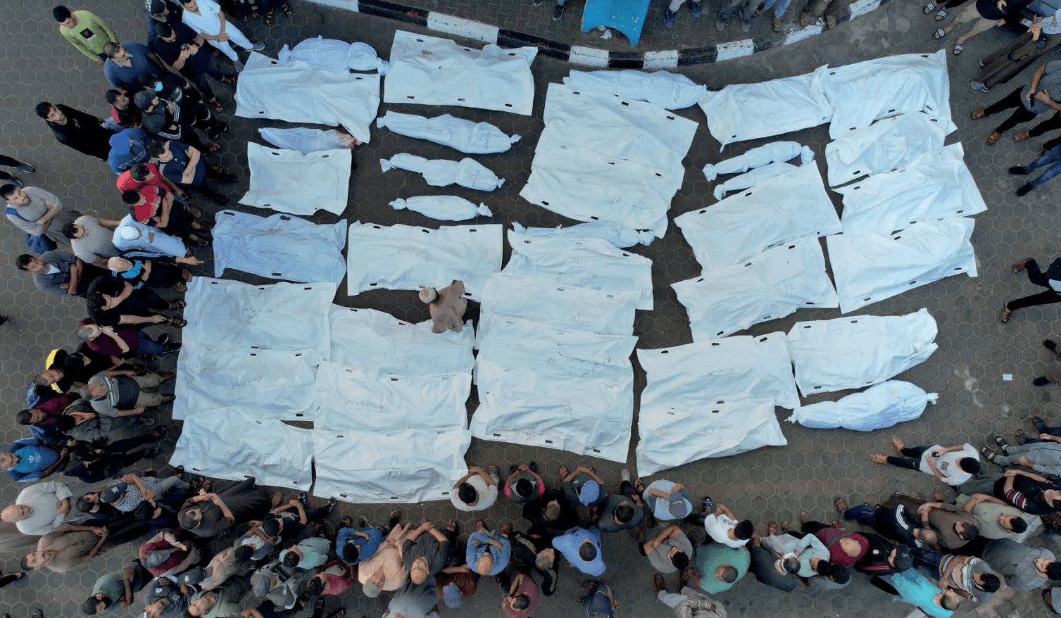 Aerial view of relatives and friends mourning the Palestinians killed in the Israeli army airstrikes on Deir al-Balah.