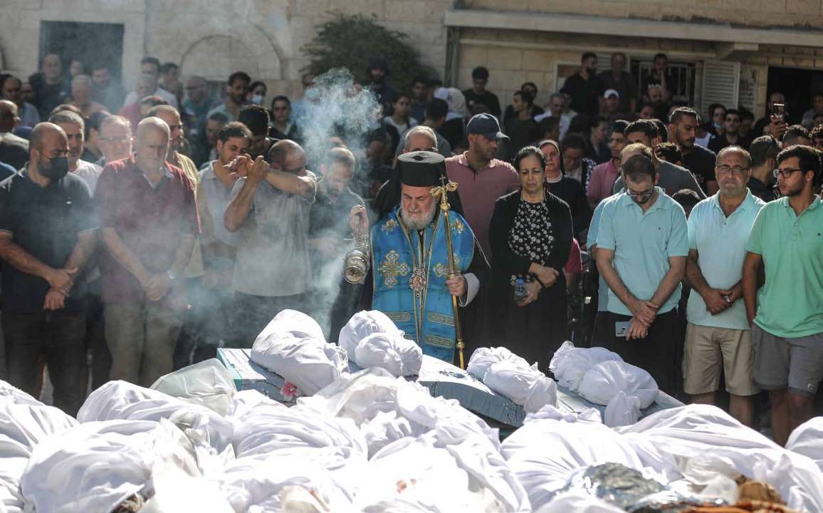 People attend the funeral ceremony of Palestinian Christians who lost their lives in Israeli army attacks on the Church of Saint Porphyrius in Gaza City, Gaza.