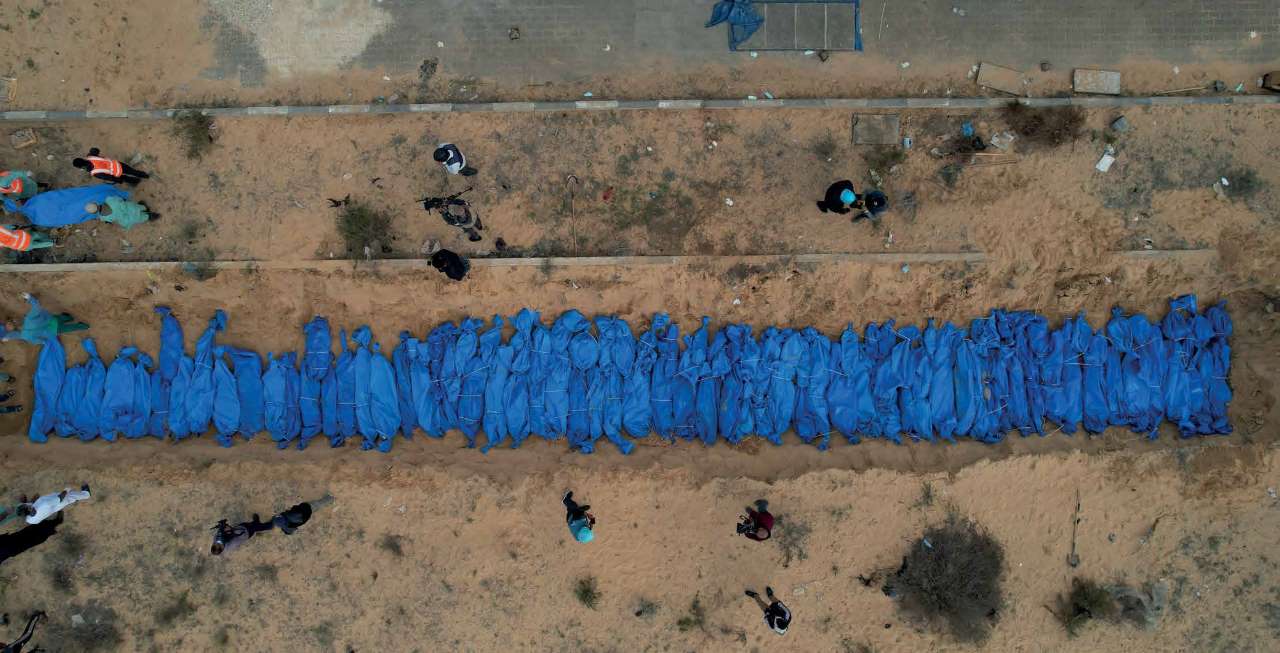 The bodies of 111 Palestinians, killed in Israeli army attacks in the northern areas of the Gaza Strip and in Gaza proper, are being laid to rest in a mass grave in the city of Khan Yunis in the southern Gaza Strip.