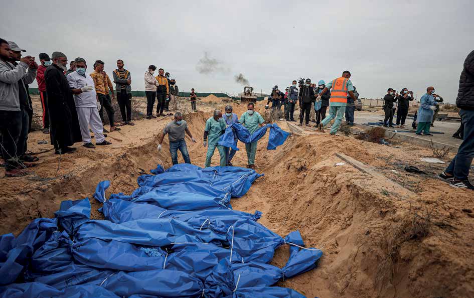 The bodies of 111 Palestinians, killed in Israeli army attacks in the northern areas of the Gaza Strip and in Gaza proper, are being laid to rest in a mass grave in the city of Khan Yunis in the southern Gaza Strip.