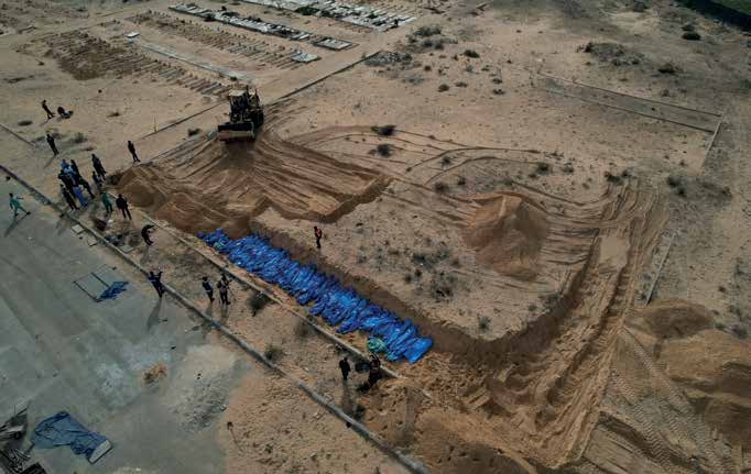 The bodies of 111 Palestinians, killed in Israeli army attacks in the northern areas of the Gaza Strip and in Gaza proper, are being laid to rest in a mass grave in the city of Khan Yunis in the southern Gaza Strip.