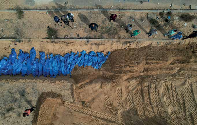 The bodies of 111 Palestinians, killed in Israeli army attacks in the northern areas of the Gaza Strip and in Gaza proper, are being laid to rest in a mass grave in the city of Khan Yunis in the southern Gaza Strip.