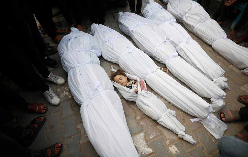 Following an Israeli military strike on the Hassan family's home in the Nuseirat Refugee Camp in central Gaza, many Palestinians, including children, lost their lives. The bodies of the deceased were brought to Al-Aqsa Martyrs Hospital in Deir al-Balah.