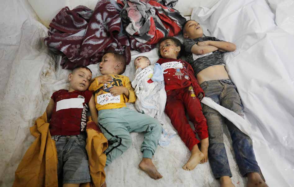 The lifeless bodies of a baby and children killed in Israeli army attacks. Palestinians, including children, injured and killed in Israeli attacks on the Al-Maghazi Refugee Camp have been brought to the Al-Aqsa Martyrs Hospital in Deir al-Balah.