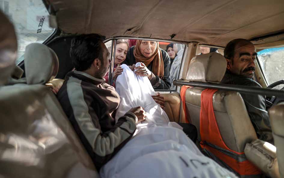 Relatives of Palestinians killed in Israeli army attacks in Deir al-Balah mourn their loved ones as they take their bodies from the Al-Aqsa Martyrs Hospital’s morgue for the funeral ceremony.