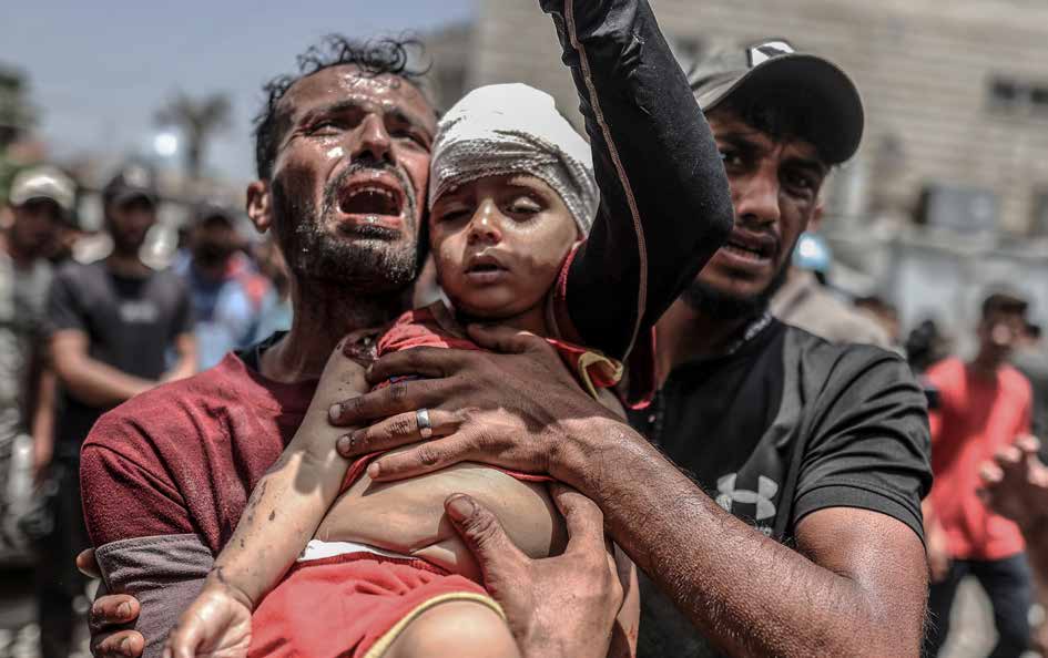 At least 40 Palestinians were killed in simultaneous heavy attacks by the Israeli military on the Nuseirat, Al- Bureij, and Al-Maghazi refugee camps in the central Gaza Strip. The bodies of those killed were taken to the Al-Aqsa Martyrs Hospital in Deir al-Balah..