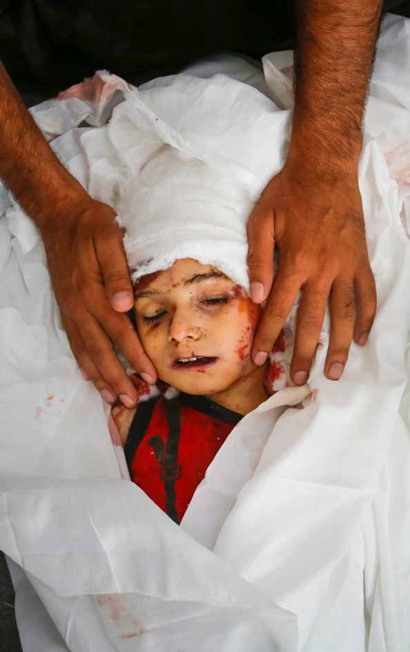 The bodies of Ahmed Shatali and his 4-year-old son Abdullah, who were killed in an Israeli military strike on their home in the Nuseirat Refugee Camp in central Gaza, were brought to the Al-Aqsa Martyrs Hospital in Deir al-Balah.