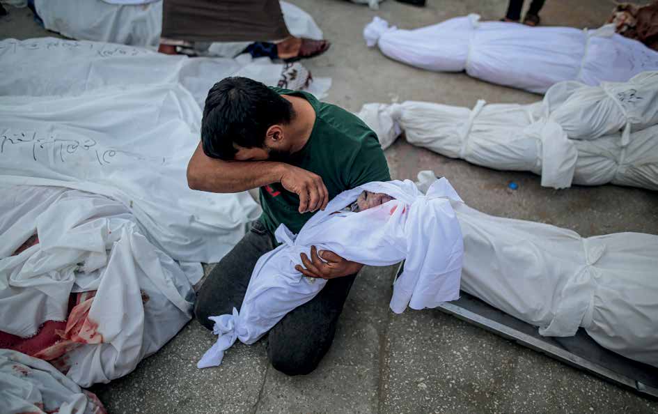 The bodies of those who lost their lives in the attacks by the Israeli army were taken for burial from the morgue of the Al-Aqsa Hospital in the city of Deir al-Balah. A father is grieving the loss of his baby.