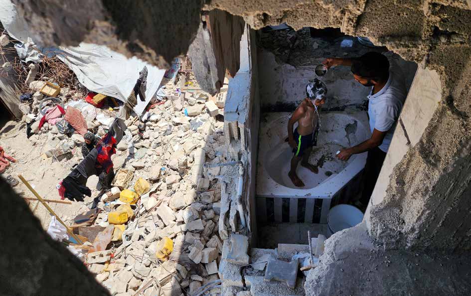 Palestinian families are clinging to life amid the rubble of their homes, destroyed in Israeli military attacks on Gaza that have lasted for months. In the Bani Suheila area of Khan Yunis, a Gazan family is giving their children a bath in the bathroom of their demolished home.