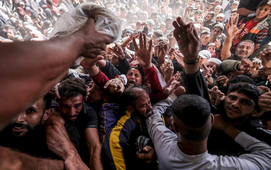 Due to Israel allowing only limited amounts of flour and fuel into Gaza, Palestinians form long lines in front of the city’s sole bakery, struggling to secure bread.