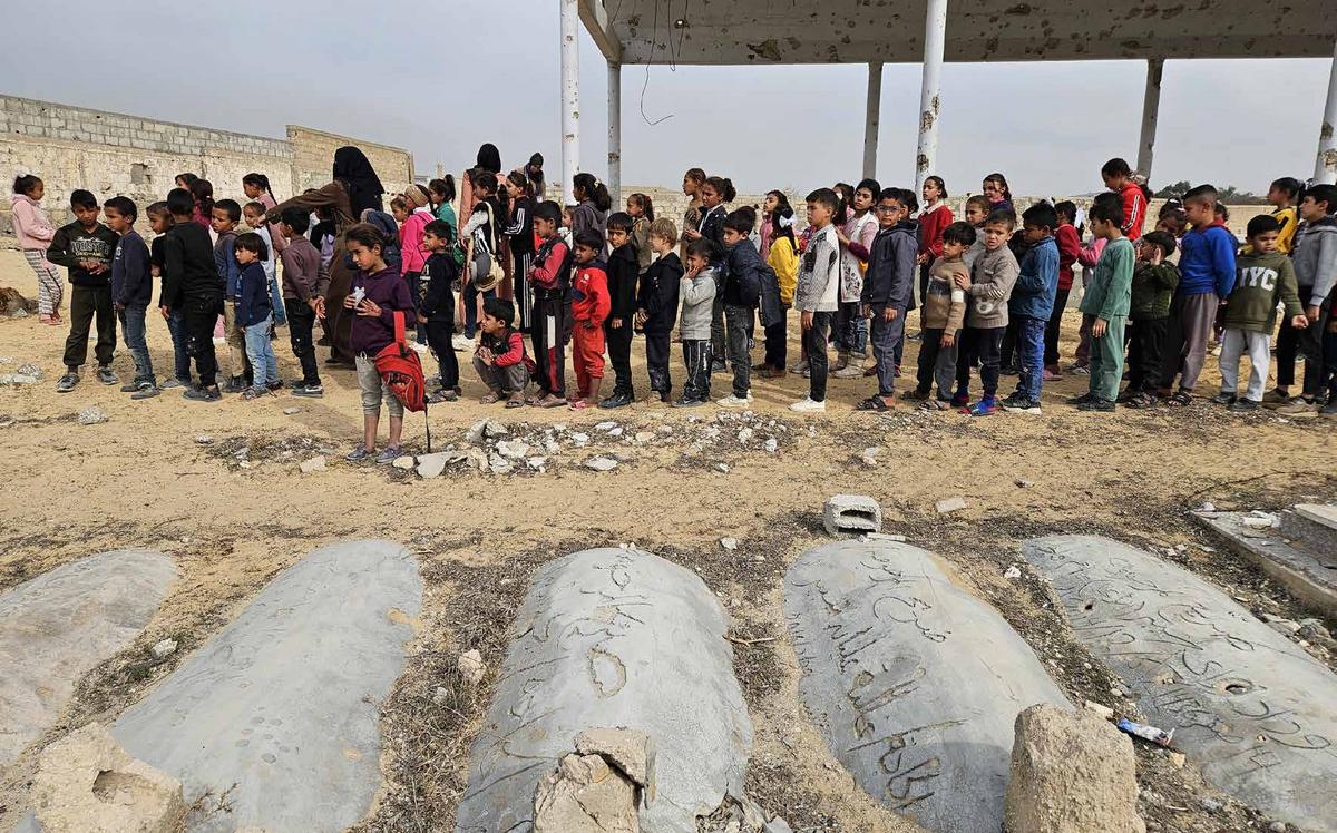 As Israeli attacks on Gaza pass the one-year mark, thousands of students remain deprived of education. In Khan Yunis, southern Gaza, students are continuing their studies with limited resources in a cemetery, as some schools have been destroyed while others have been turned into shelters.