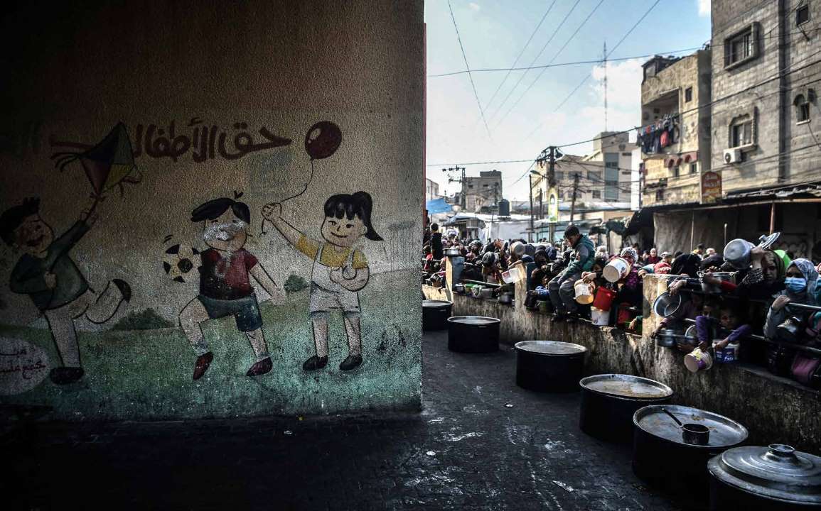 Amidst relentless Israeli army attacks on the besieged Gaza Strip, Palestinians are struggling with hunger due to the all-out embargo imposed on the region. Palestinians who have sought refuge in Rafah city, fleeing the attacks, wait for hours in line to receive meals distributed by charities.