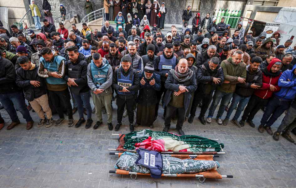 Palestinian journalist Areej Shahin and her mother were killed in an Israeli strike on their home in Nuseirat Refugee Camp, central Gaza. Their bodies were brought to al-Awda Hospital. AA cameraman Saed Abu Nabhan (far left), who will later be shot dead by an Israeli sniper on January 10, 2025, attends Shahin’s funeral, standing alongside his fellow journalists.