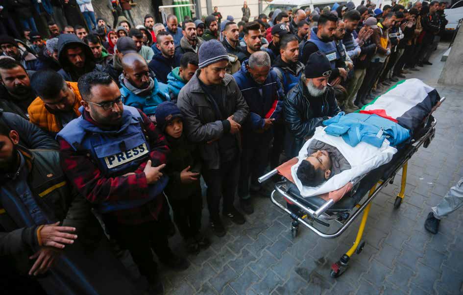 Anadolu Ajansı cameraman Saed Abu Nabhan was killed by an Israeli sniper while on duty in the Nuseirat Refugee Camp in Gaza. His funeral ceremony, held just outside al-Awda Hospital in Nuseirat, is attended by relatives, colleagues, and friends.