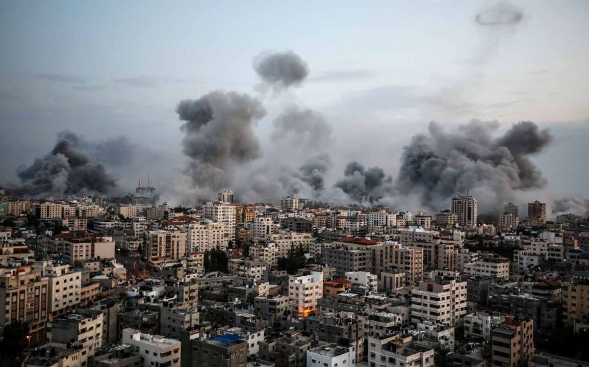 Smoke rises from buildings targeted by the Israeli army's airstrikes in the Rimal neighborhood of Gaza City.