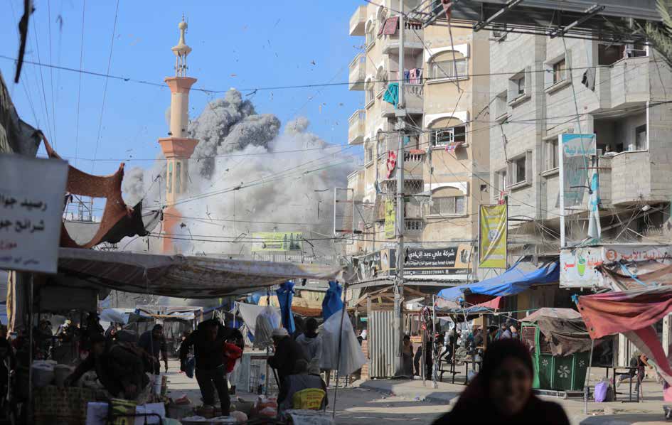 Smoke and dust engulf the surrounding area after an Israeli airstrike on Al-Farouq Mosque in the Nuseirat Refugee Camp, located in central Gaza Strip.