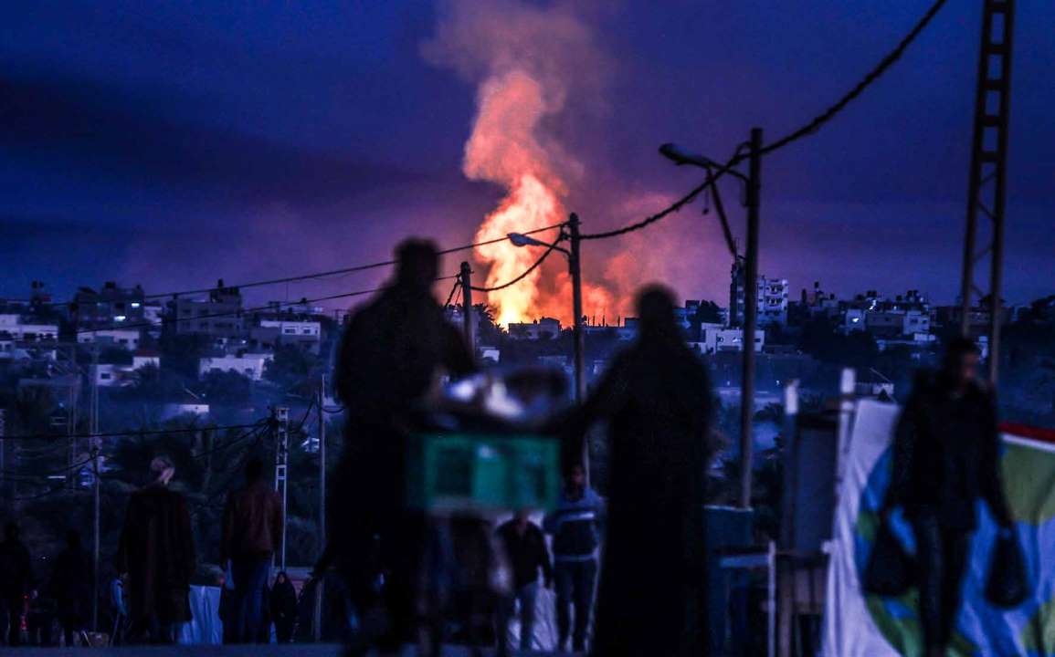 Smoke billows from different points along Salahaddin Street in the town of Deir al-Balah as a result of Israeli army attacks.